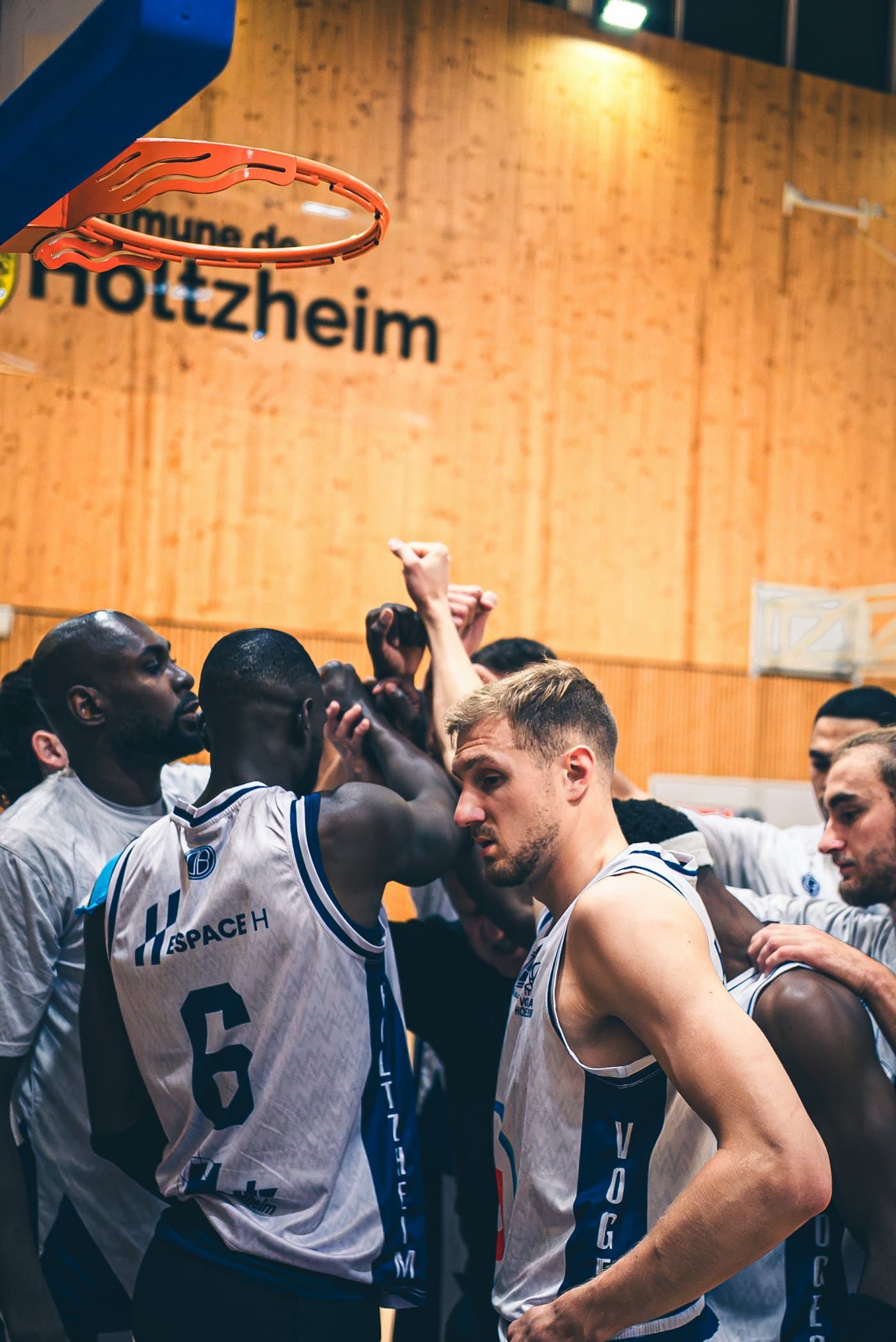 Amateur basketball team in a huddle